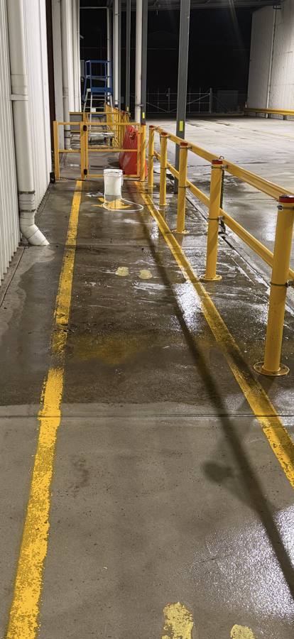 Warehouse pedestrian walkway before cleaning